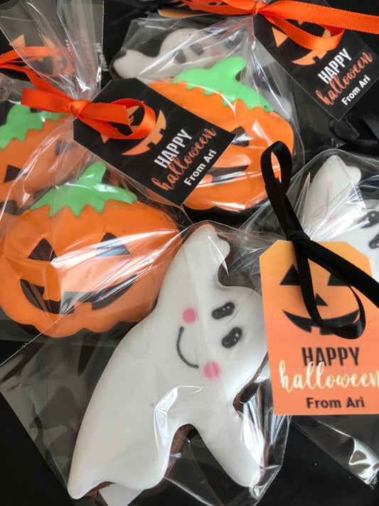 hand iced Halloween biscuits. Ghost biscuits. Pumpkins biscuits. individually wrapped, tied with ribbon and a tag.