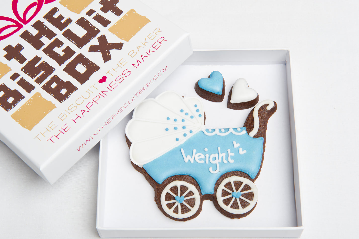 blue pram biscuit for new baby boy gift, two mini heart biscuits displayed in biscuit card