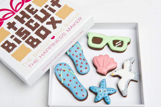 summer biscuit gift. Flip flop cookies with iced sunglasses and summer themed biscuits in a box.
