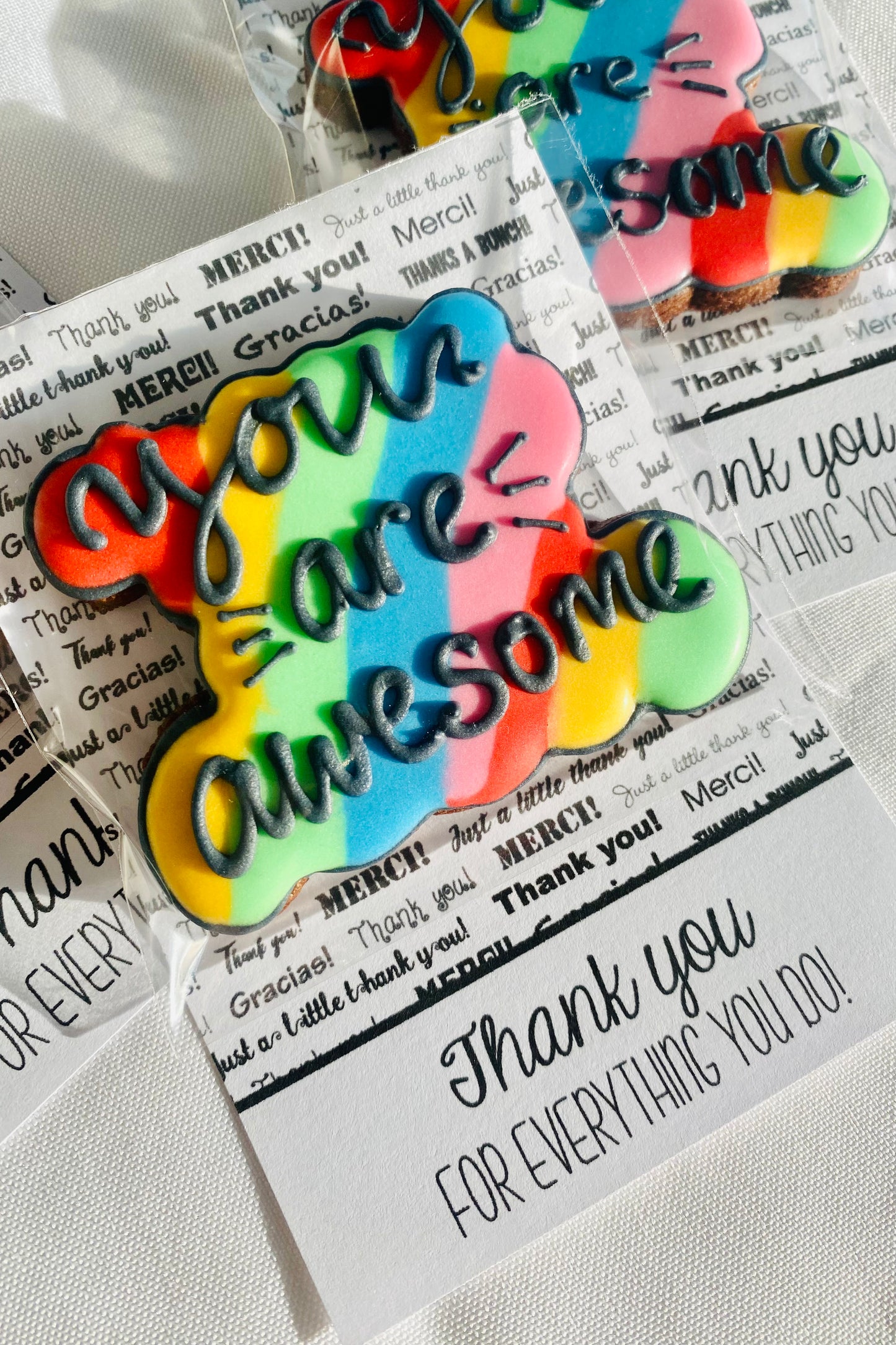 cookie card with rainbow biscuit and black icing text saying you are awesome, employee appreciation gift
