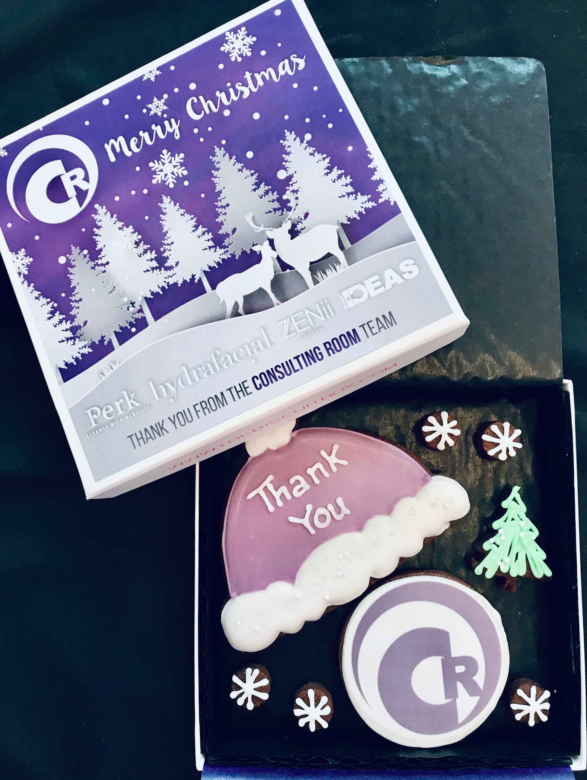 purple corporate Christmas biscuits. Branded biscuit box lid with customers logo and matching purple cookies.