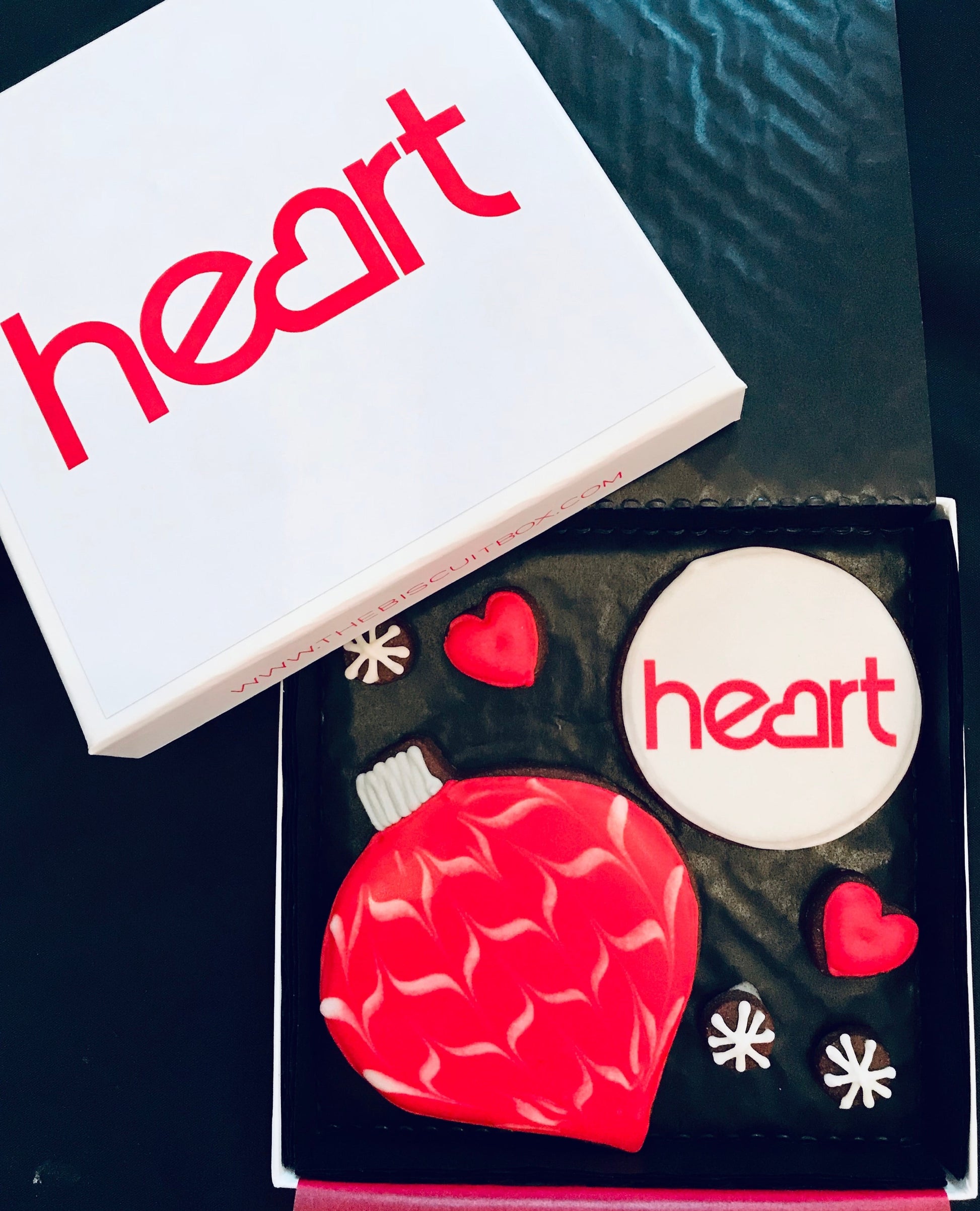 heart fm biscuit card and matching red Christmas cookies. Red biscuit bauble and corporate gift example.