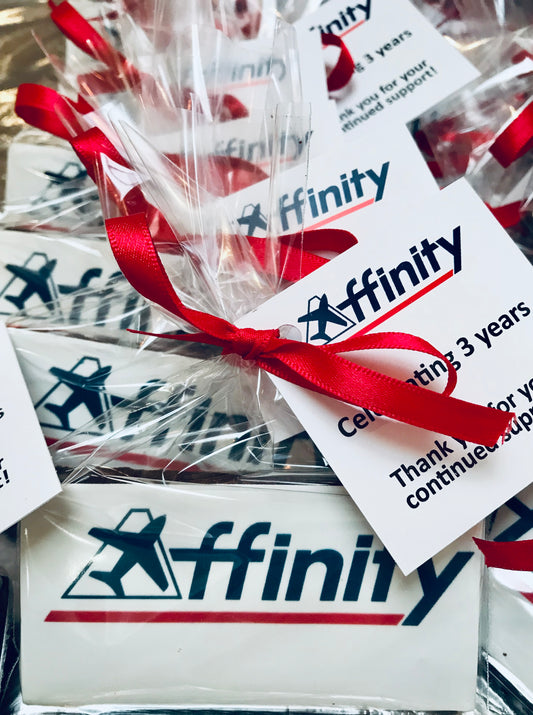 Affinity logo cookies individually wrapped in cellophane and tied with ribbon. Branded gift tag included.