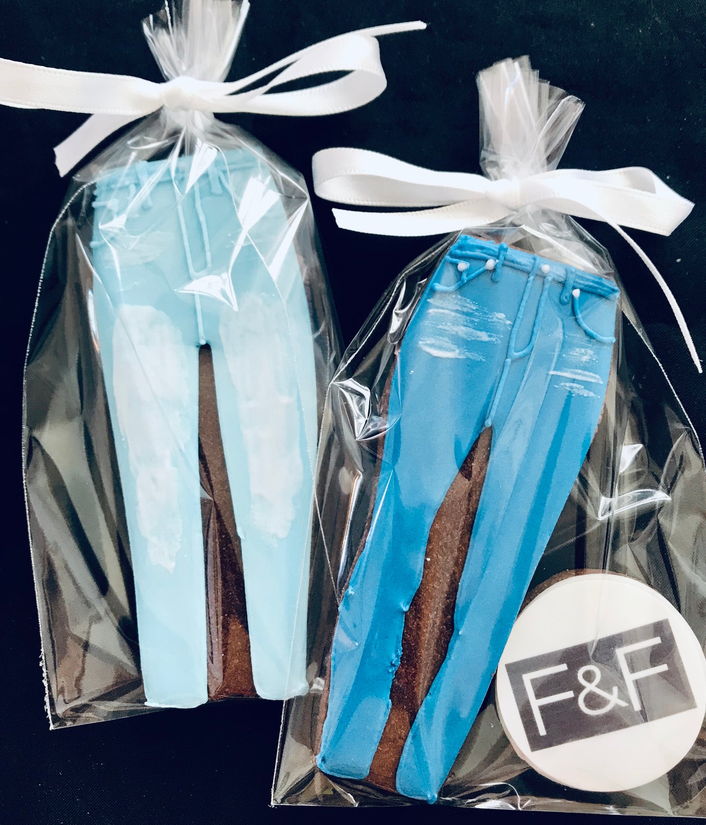 F&F jeans biscuits, individually wrapped one cellophane to celebrate the launch of a new range of jeans. hand iced jeans cookies.