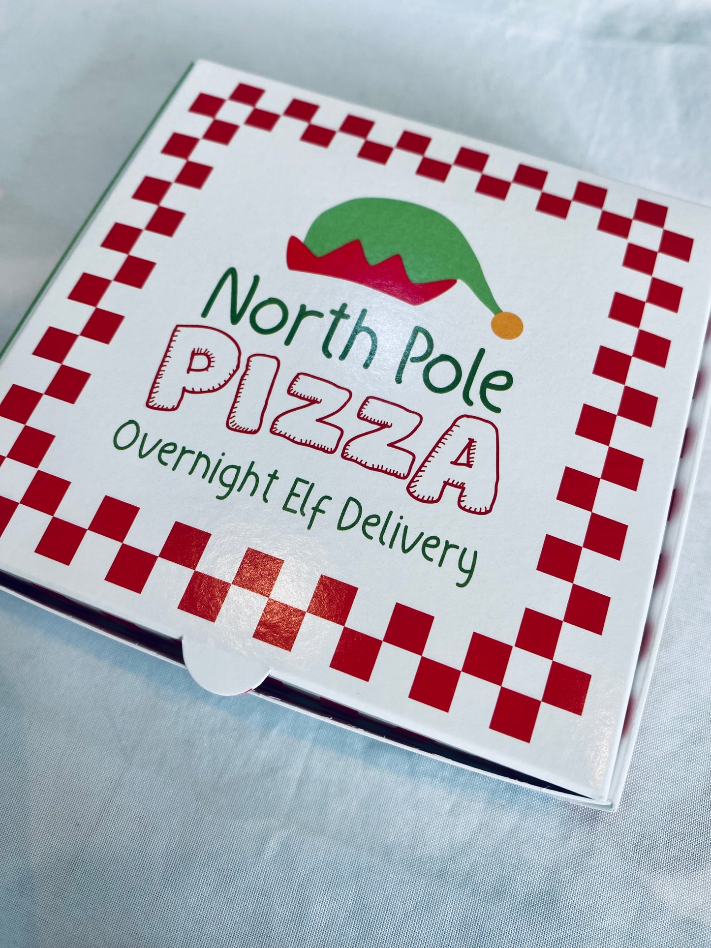 picture of the elf not he shelf pizza packaging straight from the North Pole.