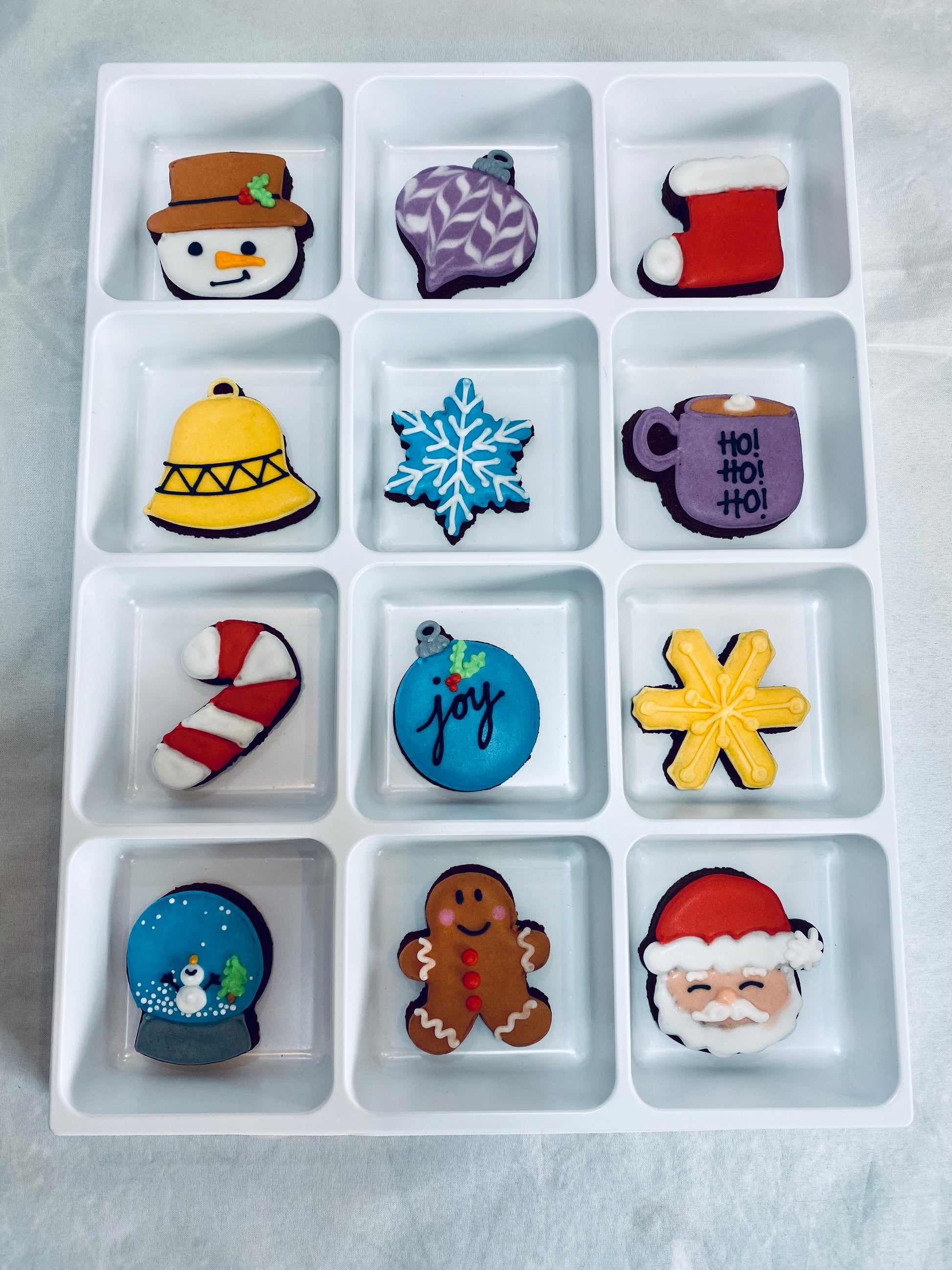 a sneak peek inside the biscuit advent calendar to show each of the mini biscuits you receive.