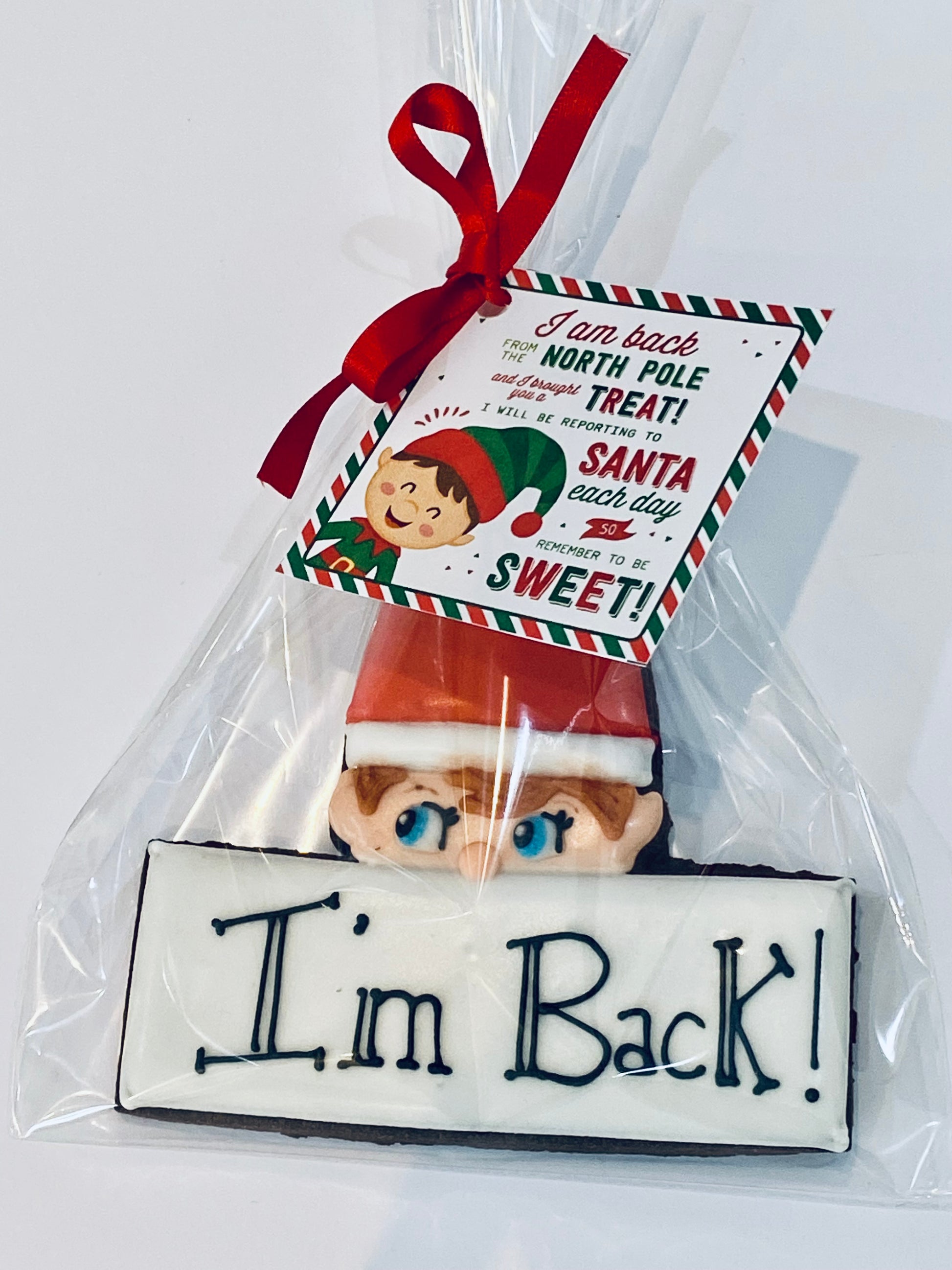 elf on the shelf I'm back cookie individually wrapped in cellophane, tied with ribbon and a mini card.