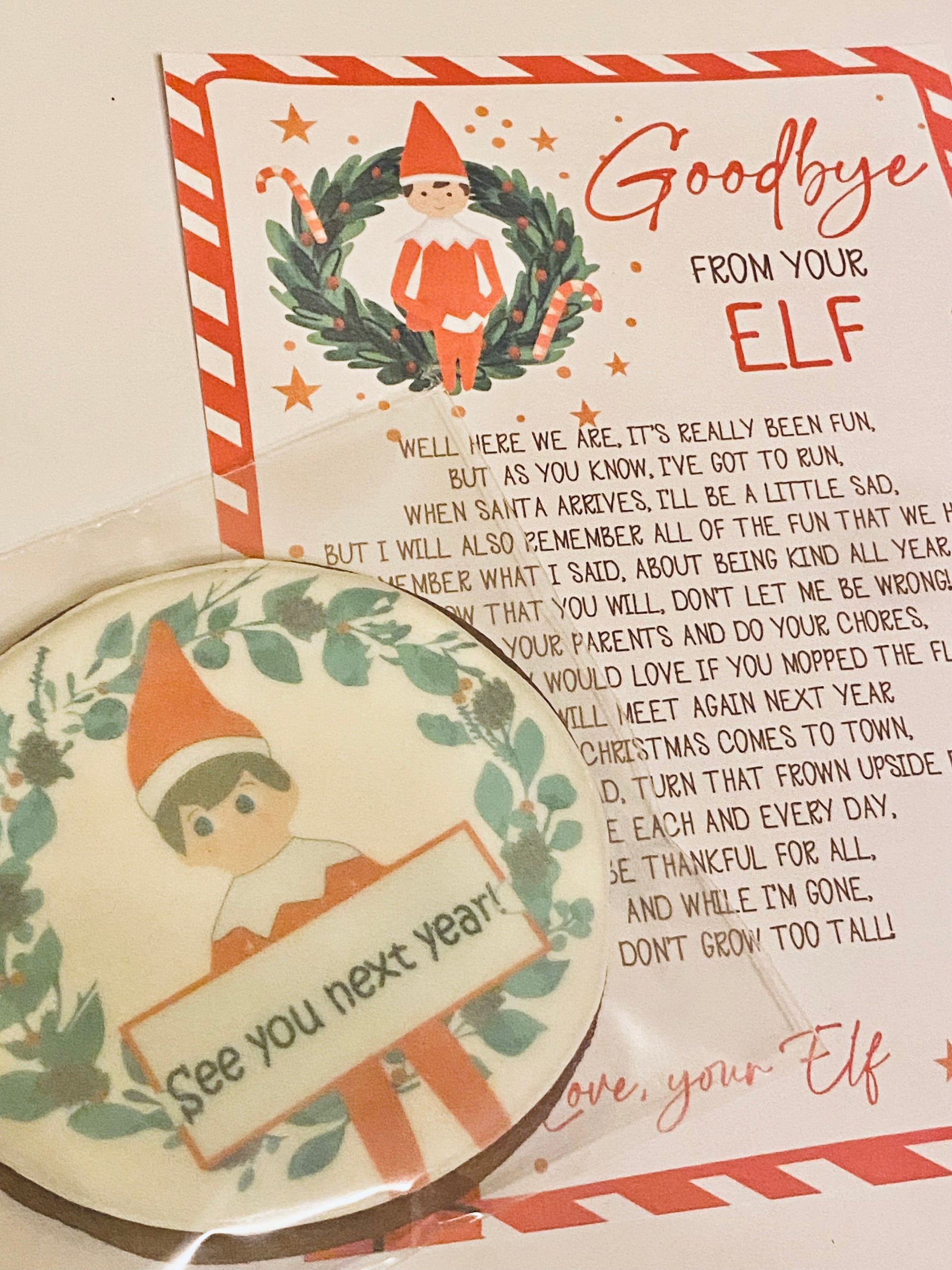 large printed biscuit with elf design saying see you next year and matching certificate.