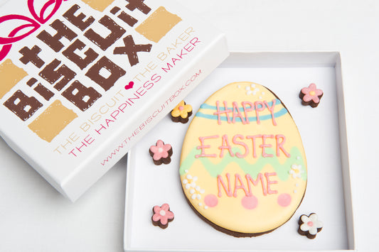 large Easter egg biscuits with happy Easter iced onto it. You can add a personalised name onto the cookie, includes mini flowers biscuits in a. small box.