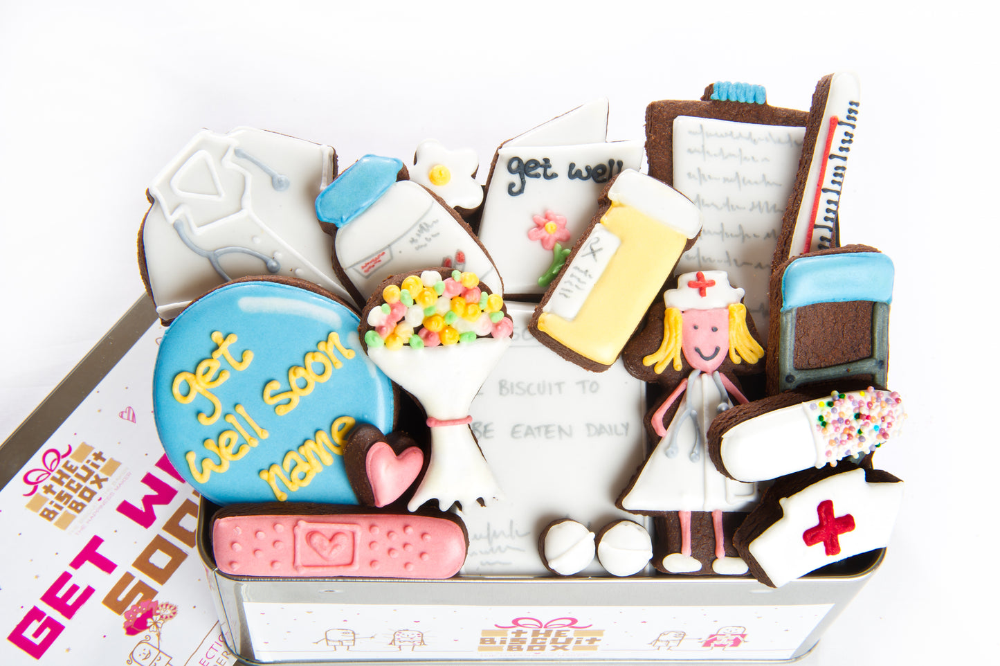 get well soon biscuit tin. hand iced nurse biscuit, prescription biscuit. Mini pills cookies and doctors coat cookies. presented in a get well themed tin.