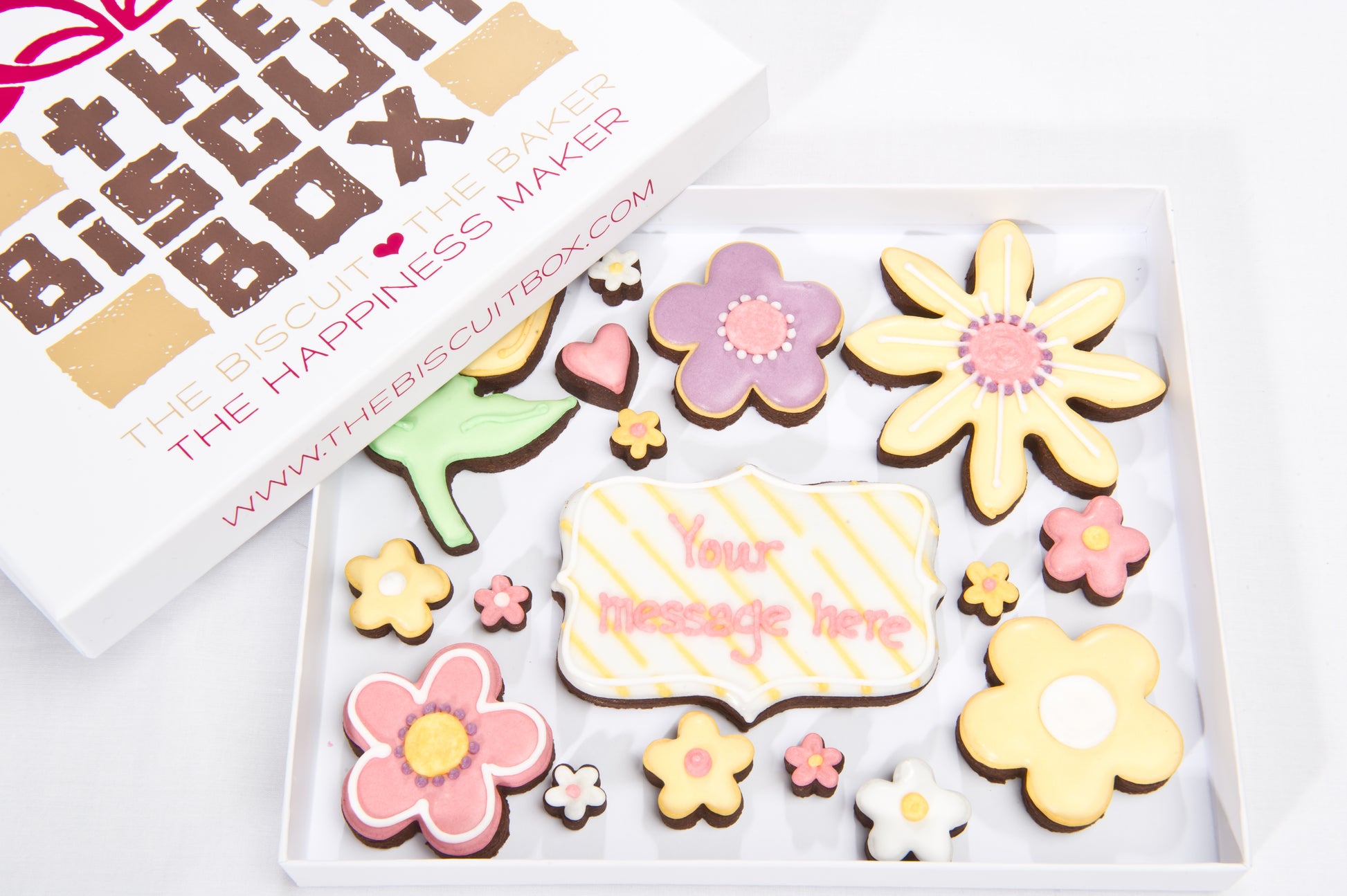 box of flower biscuits with central plaque biscuit that can be personalised with any message.