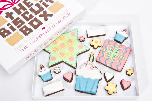 box of iced luxury birthday biscuits. present cookie, birthday cake cookie,. birthday biscuits in a box to send through the post. personalised birthday star cookie