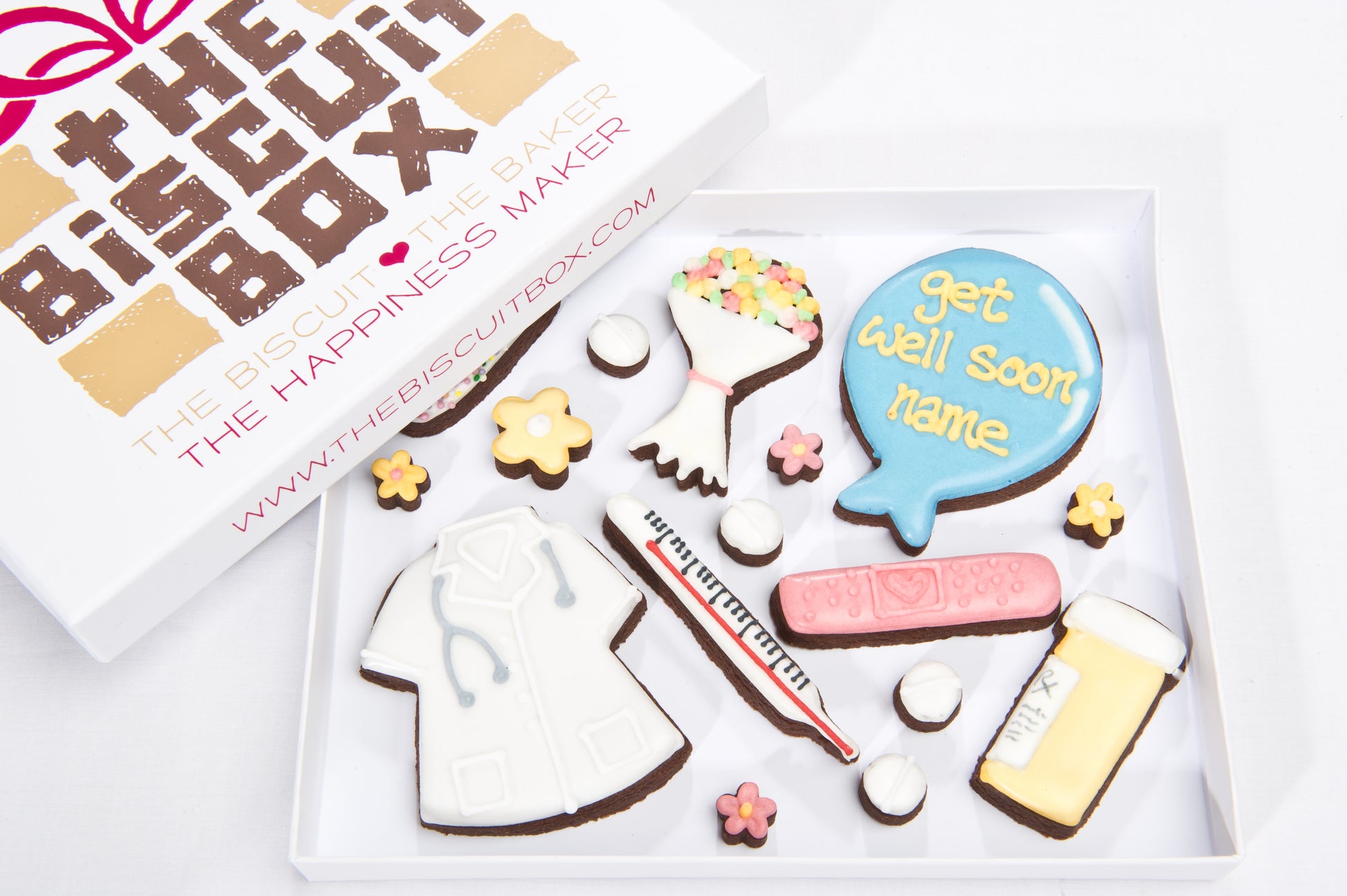 a shallow biscuit box with get well soon themed cookies. Balloon biscuit with get well soon plus a personalised name iced onto it. Plaster biscuit and mini flowers, doctors coat biscuit .