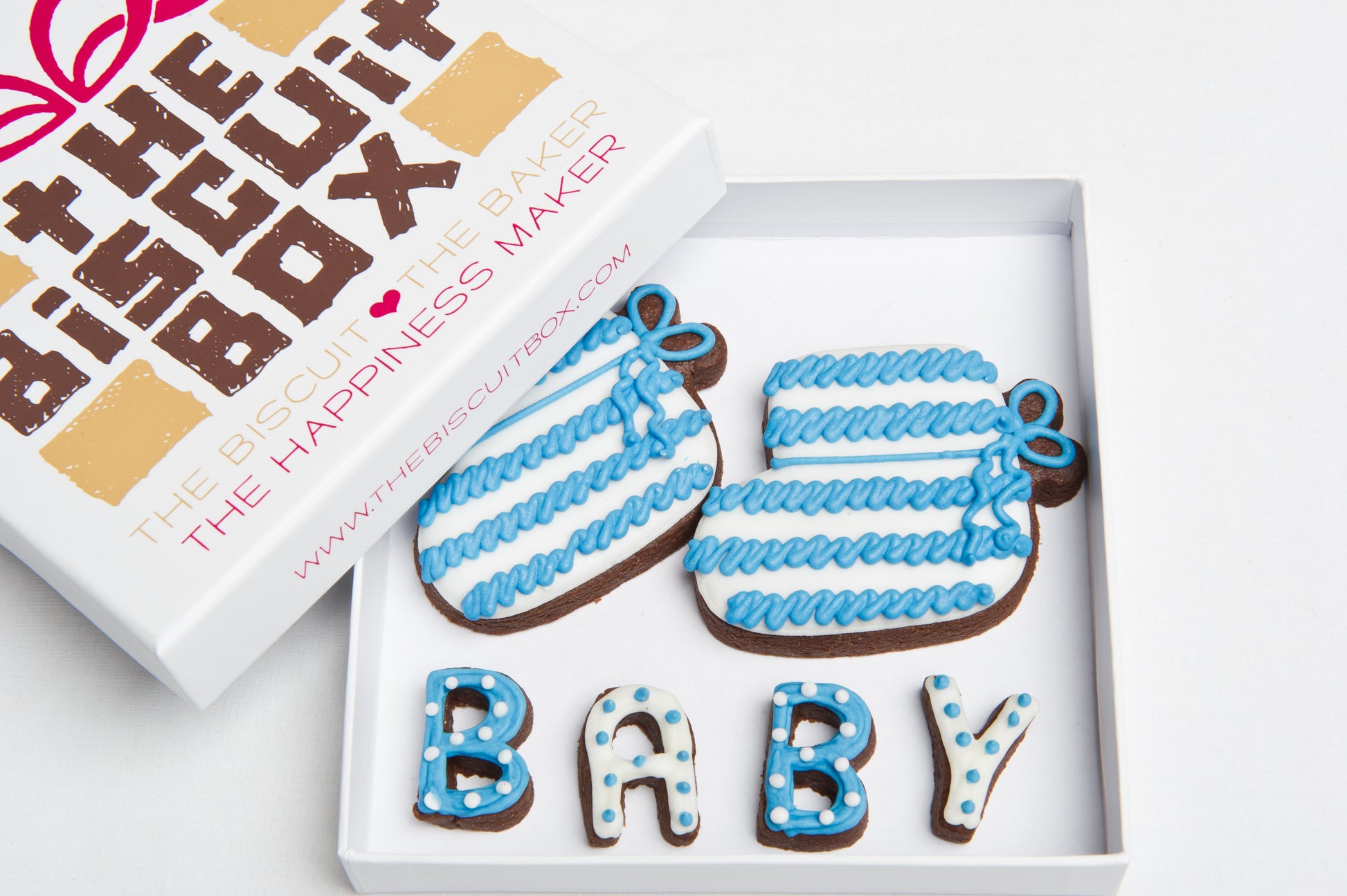baby boy booties blue biscuits in a box with branded lid