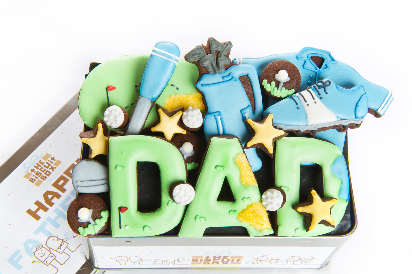 a Father's Day tin of biscuits with a golfing theme.  Dad iced biscuits. golf club, golf shirt and golf bag designs iced onto chocolate biscuits displayed in Father's day gift tin.