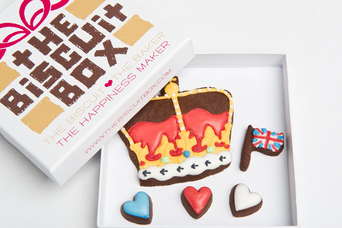 crown cookie with red and blue heart biscuits in a box that will fit through a letterbox.