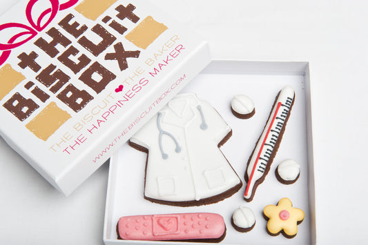 get well biscuits in a box that can be posted. Doctors coat, thermometer and mini pill cookies all hand iced.